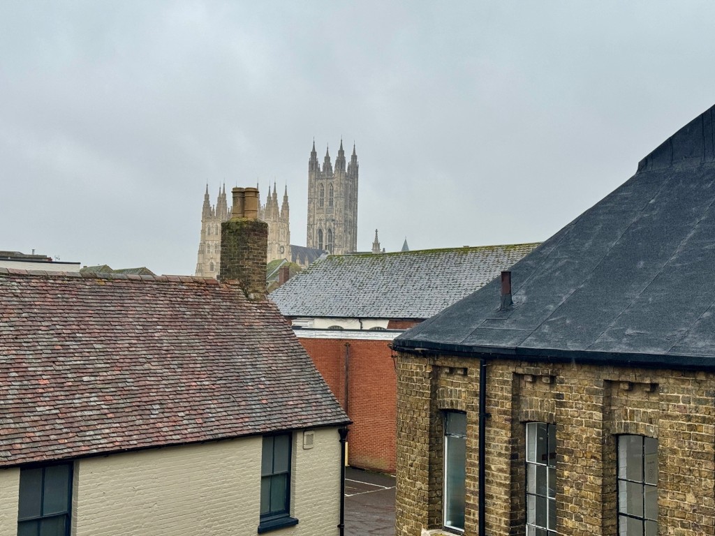 Lot: 60 - DOUBLE FRONTED PERIOD BUILDING IN CITY LOCATION - View from top floor window over rooftops towards Canterbury Cathedral